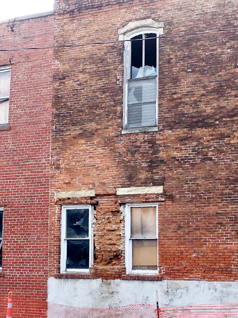 Some of the broken windows on the building